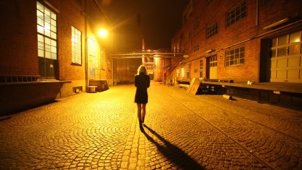 woman walking alone at night