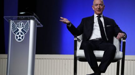 Jeff Bezons sitting on a stage.