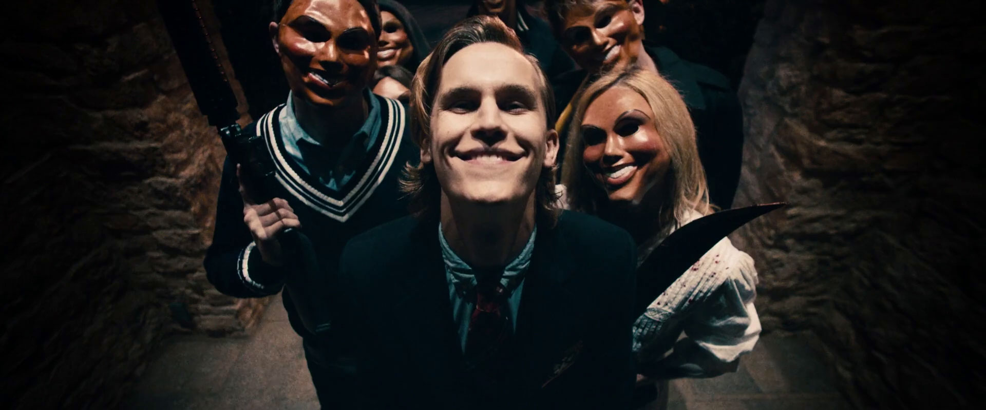 A group of Purgers stalk a family in 2013's The Purge