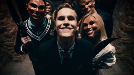 A group of Purgers stalk a family in 2013's The Purge