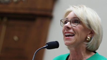 Betsy DeVos is thinking about all those puppies she's gonna turn into coats.