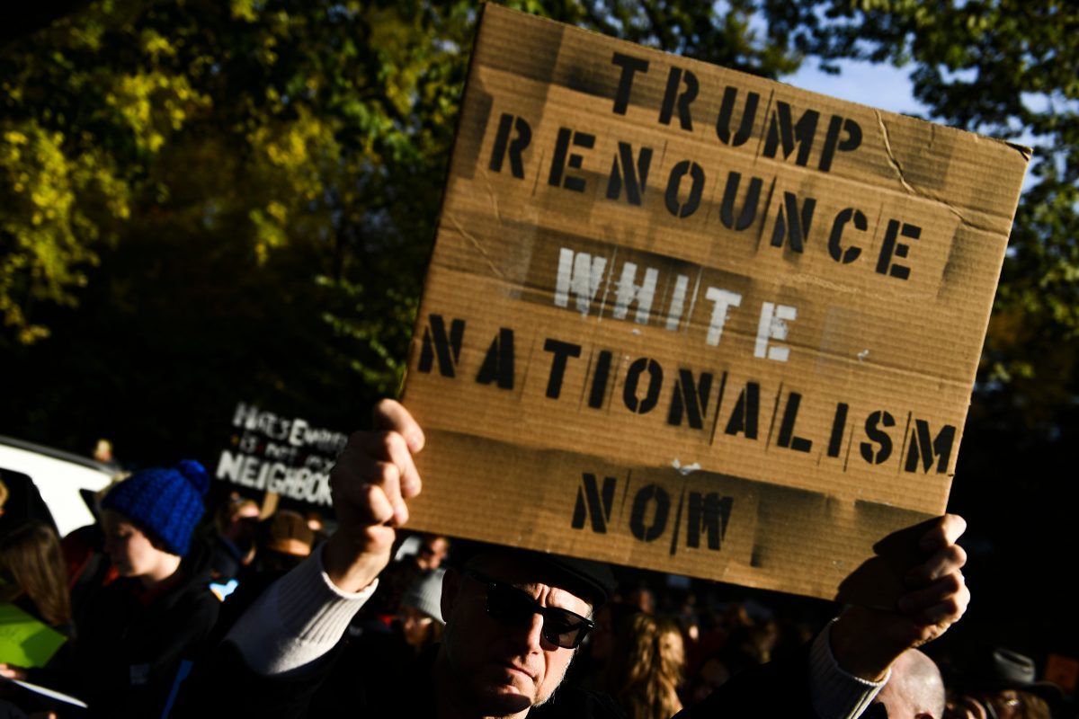 white nationalist protest sign trump