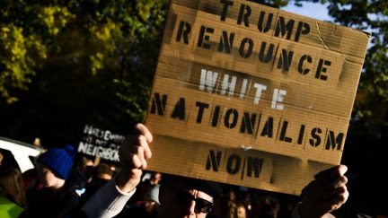 white nationalist protest sign trump