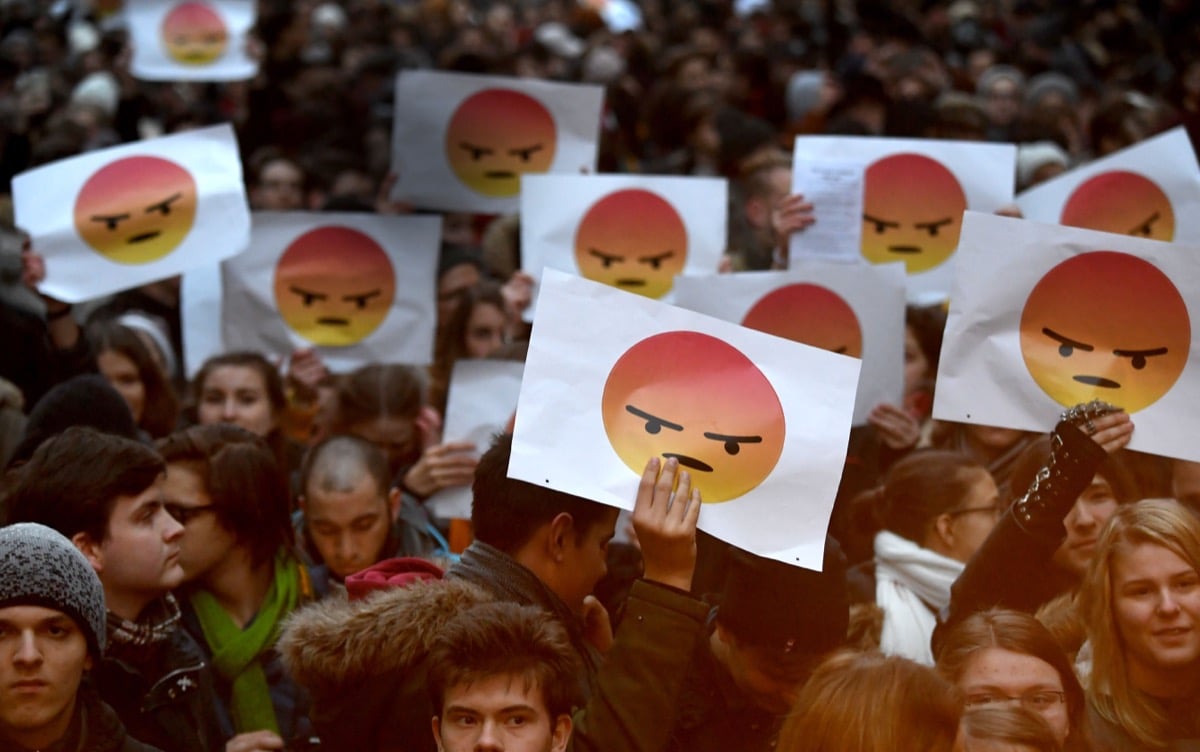 students protest with angry emoji signs