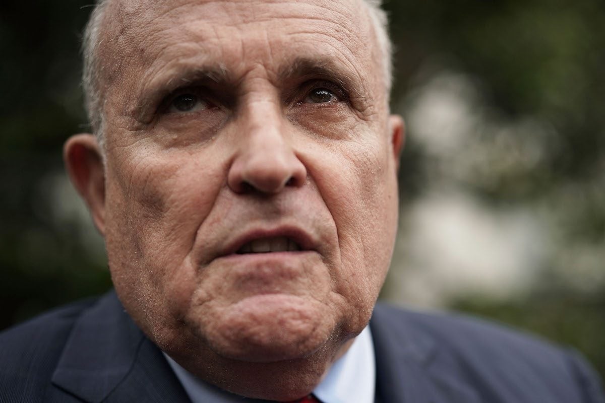 Rudy Giuliani looks concerned in a close-up.