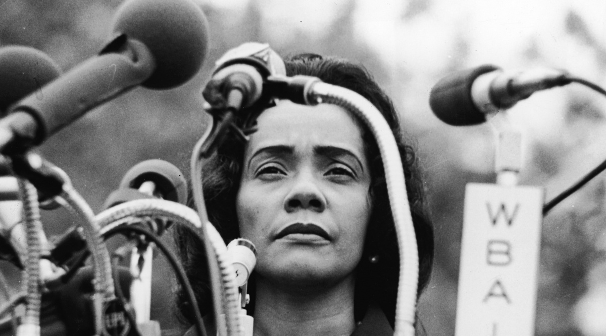 American civil rights campaigner, and widow of Dr. Martin Luther King Jr., Coretta Scott King (1927 - 2006) stands behind a podium covered in microphones at Peace-In-Vietnam Rally, Central Park, New York, April 27, 1968. (Photo by Hulton Archive/Getty Images)