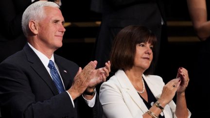 Republican vice presidential candidate Mike Pence stands with his wife Karen Pence on the fourth day of the Republican National Convention on July 21, 2016 at the Quicken Loans Arena in Cleveland, Ohio. Republican presidential candidate Donald Trump received the number of votes needed to secure the party's nomination. An estimated 50,000 people are expected in Cleveland, including hundreds of protesters and members of the media. The four-day Republican National Convention kicked off on July 18.