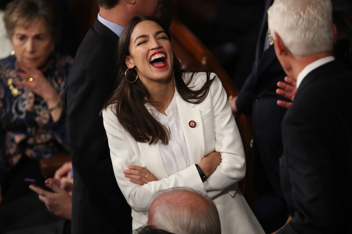 Member elect Rep. Alexandria Ocasio-Cortez (D-NY) talks to fellow members of Congress during the first session of the 116th Congress at the U.S. Capitol January 03, 2019 in Washington, DC.