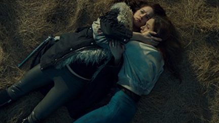 Wynonna Earp and Waverly Earp Hugging on the ground in an episode of the Wynonna Earp.