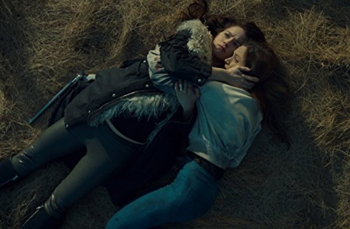 Wynonna Earp and Waverly Earp Hugging on the ground in an episode of the Wynonna Earp.