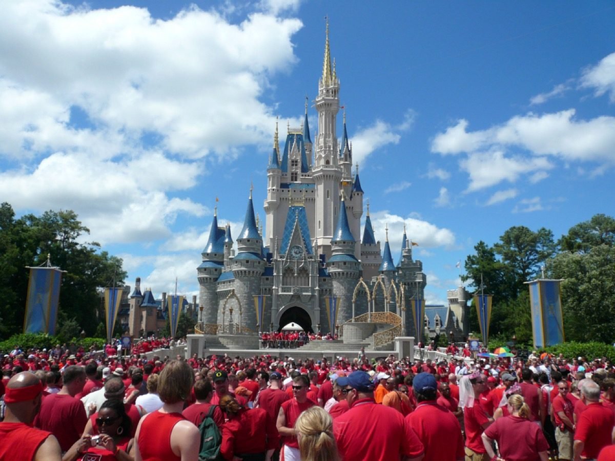 A sea of people in red shirts at Cinderella's Castle at Walt Disney World's Gay Days.