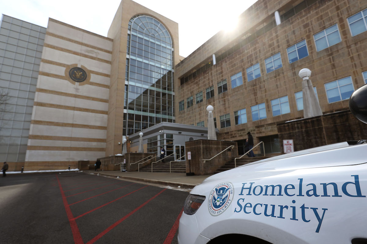 A Police car is parked in front of the United States District Court Greenbelt Division