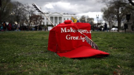 An oversized replica of a 'Make America Great Again' hat sits on the grass across from the White House during a demonstration against the Dakota Access Pipeline