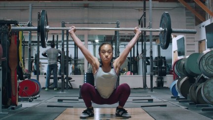 Young girl weight-lifts like a boss in Nike ad.