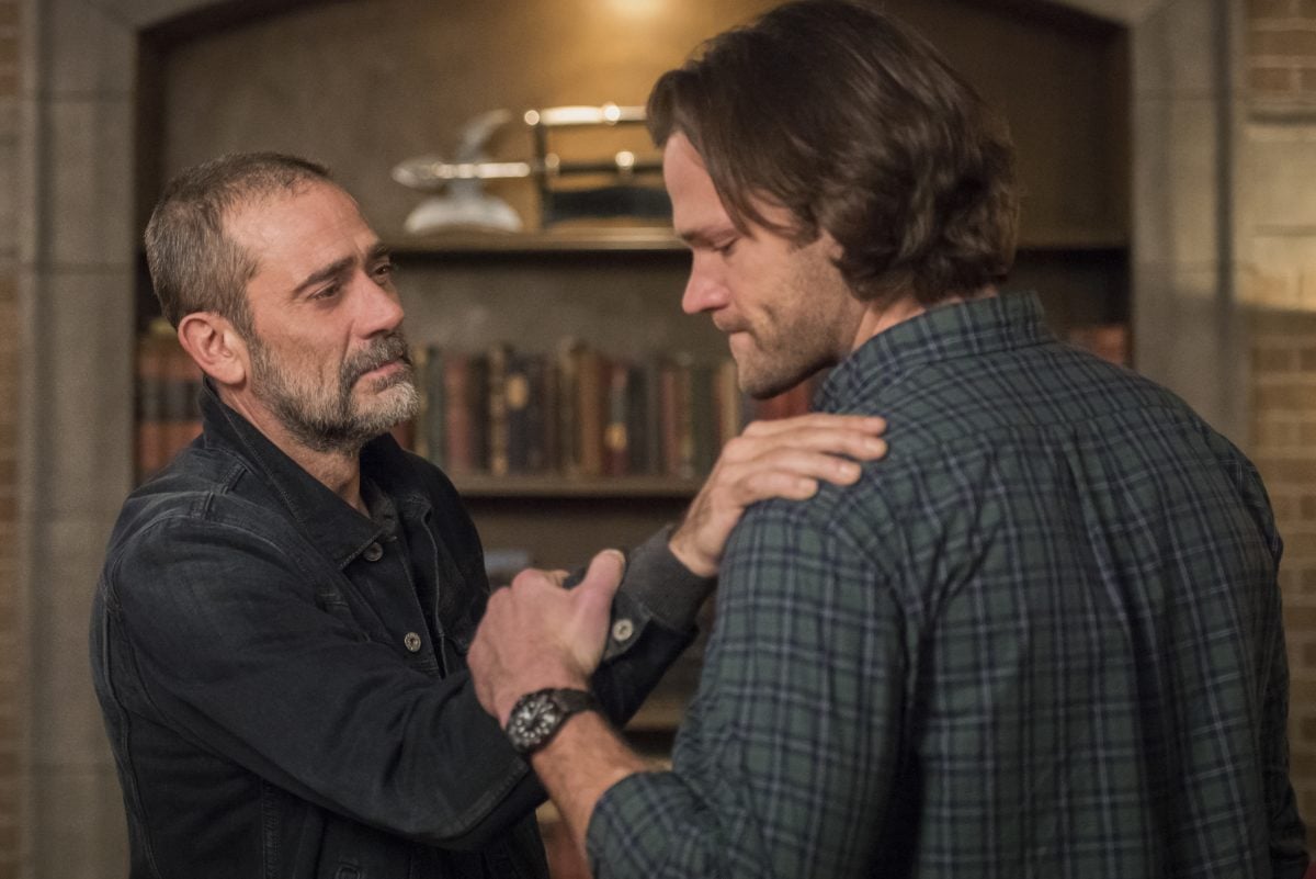 John Winchester places a hand on Sam Winchester's shoulder in Supernatural.