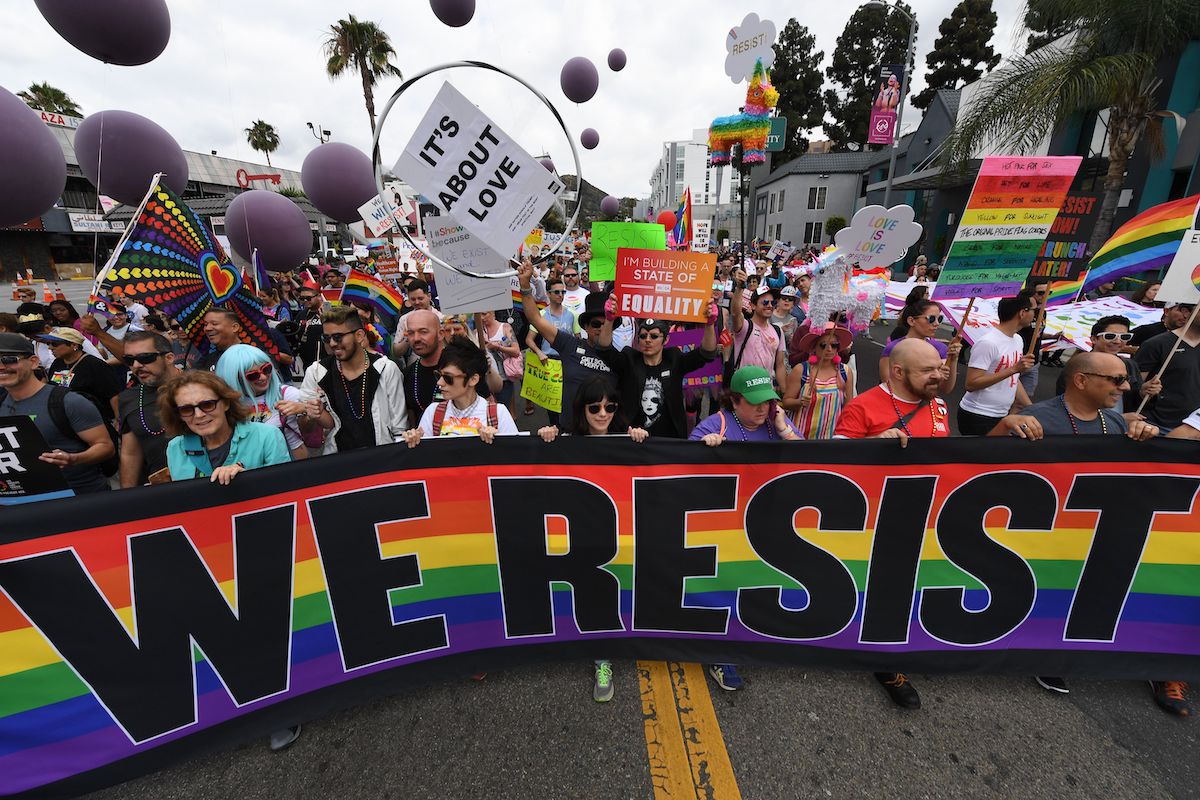 People march during the #ResistMarch at the 47th annual LA Pride Festival in Hollywood, California