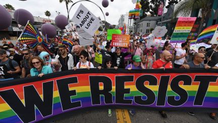 People march during the #ResistMarch at the 47th annual LA Pride Festival in Hollywood, California