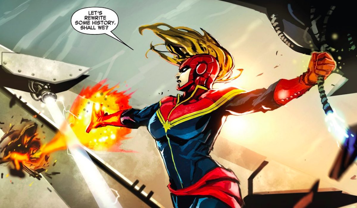 Captain Marvel firing energy blasts and talking about changing history in the comics.