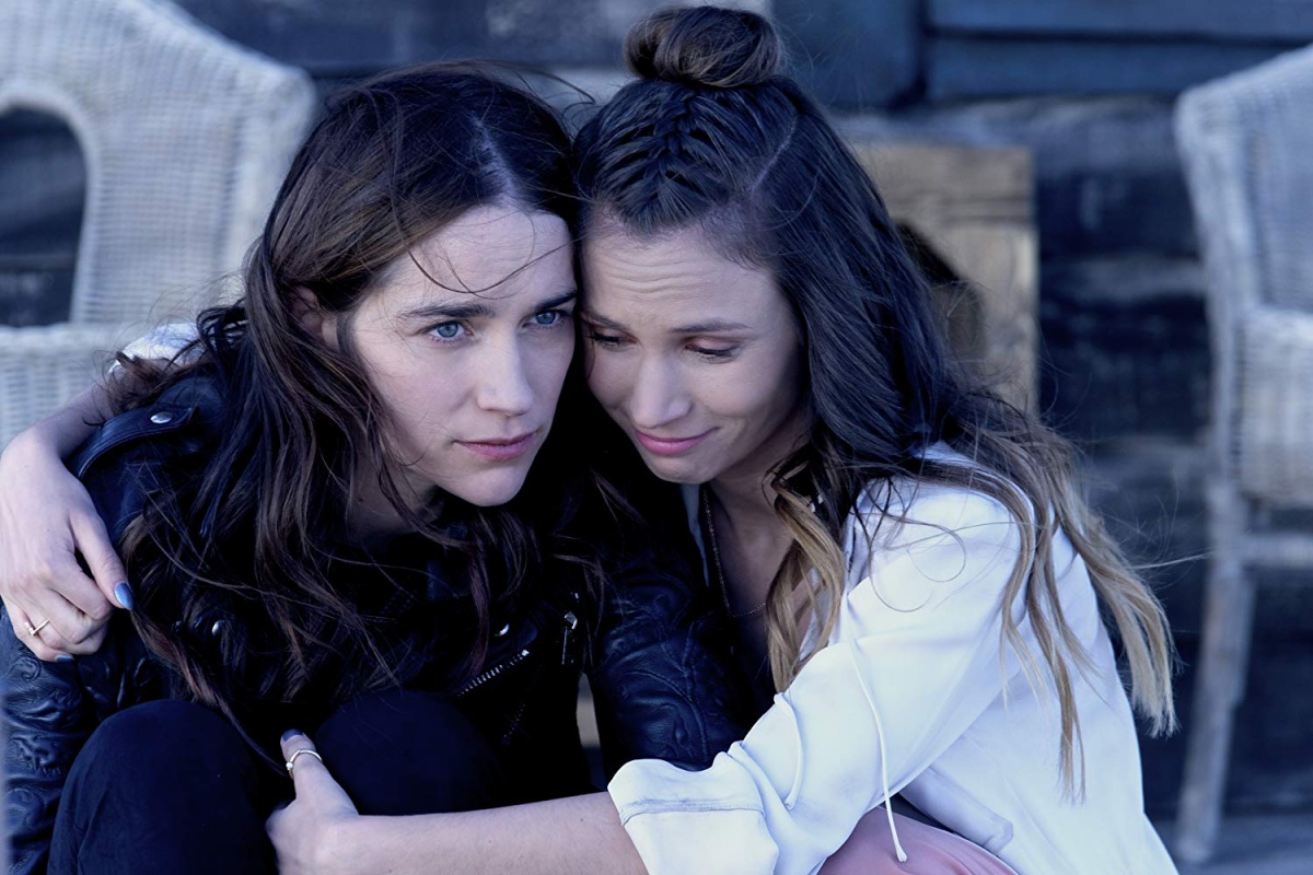 Melanie Scrofano and Dominique Provost-Chalkley in Wynonna Earp (2016)