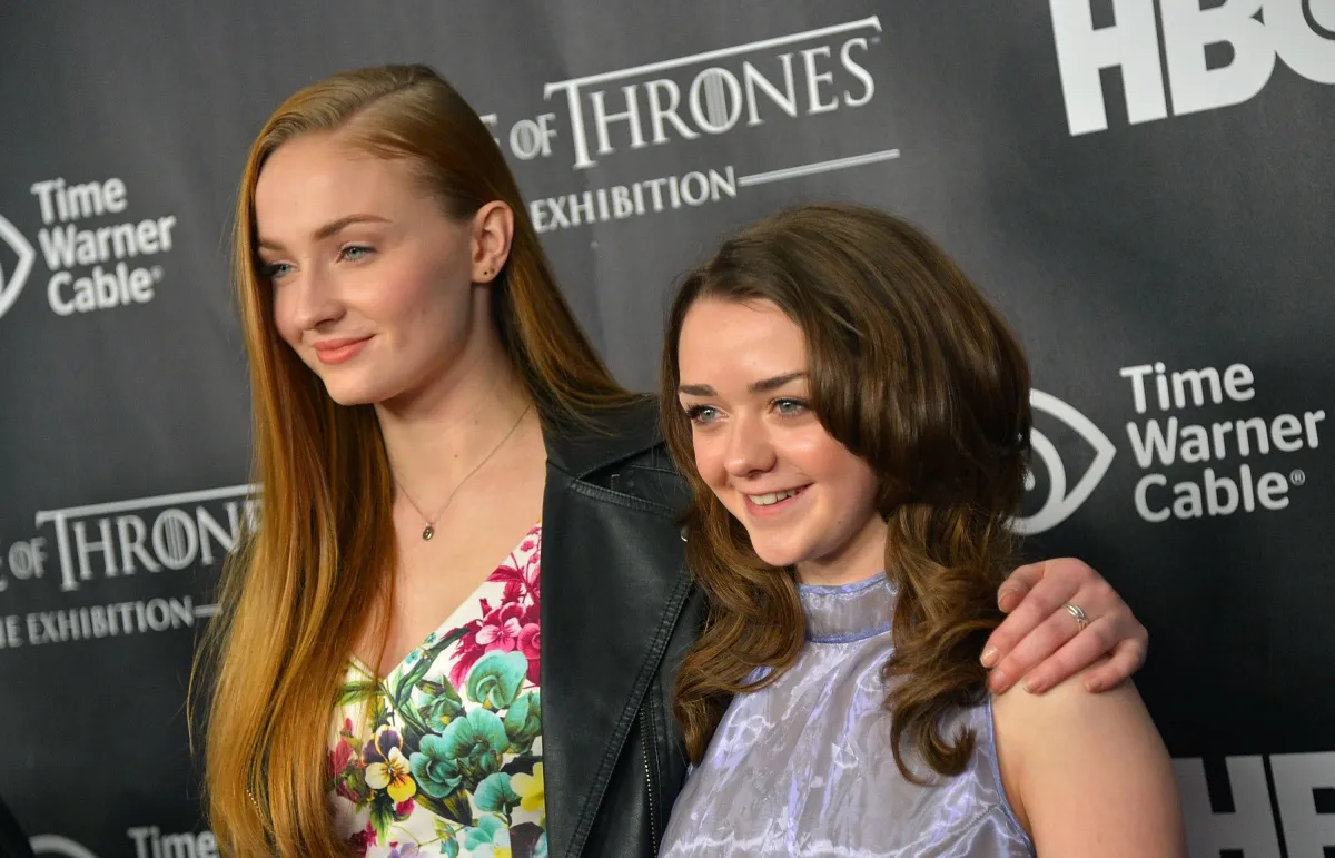 Actors Sophie Turner (L) and Maisie Williams attend 'Game Of Thrones' The Exhibition New York Opening at 3 West 57th Avenue on March 27, 2013 in New York City. (Photo by Mike Coppola/Getty Images)