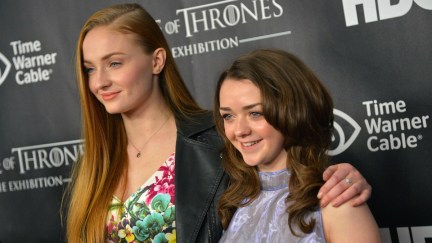 Actors Sophie Turner (L) and Maisie Williams attend 'Game Of Thrones' The Exhibition New York Opening at 3 West 57th Avenue on March 27, 2013 in New York City. (Photo by Mike Coppola/Getty Images)