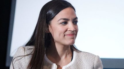 Alexandria Ocasio-Cortez smiles through the BS.