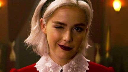 Kiernan Shipka as Sabrina winks at the camera in Chilling Adventures of Sabrina.