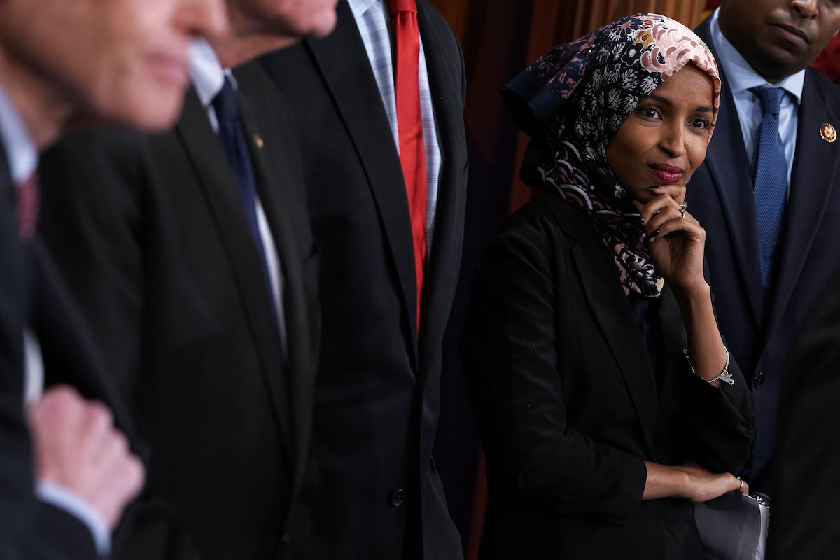 U.S. Rep. Ilhan Omar (D-MN) listens during a news conference.
