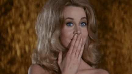 Jane Fonda covers her mouth in Barbarella.