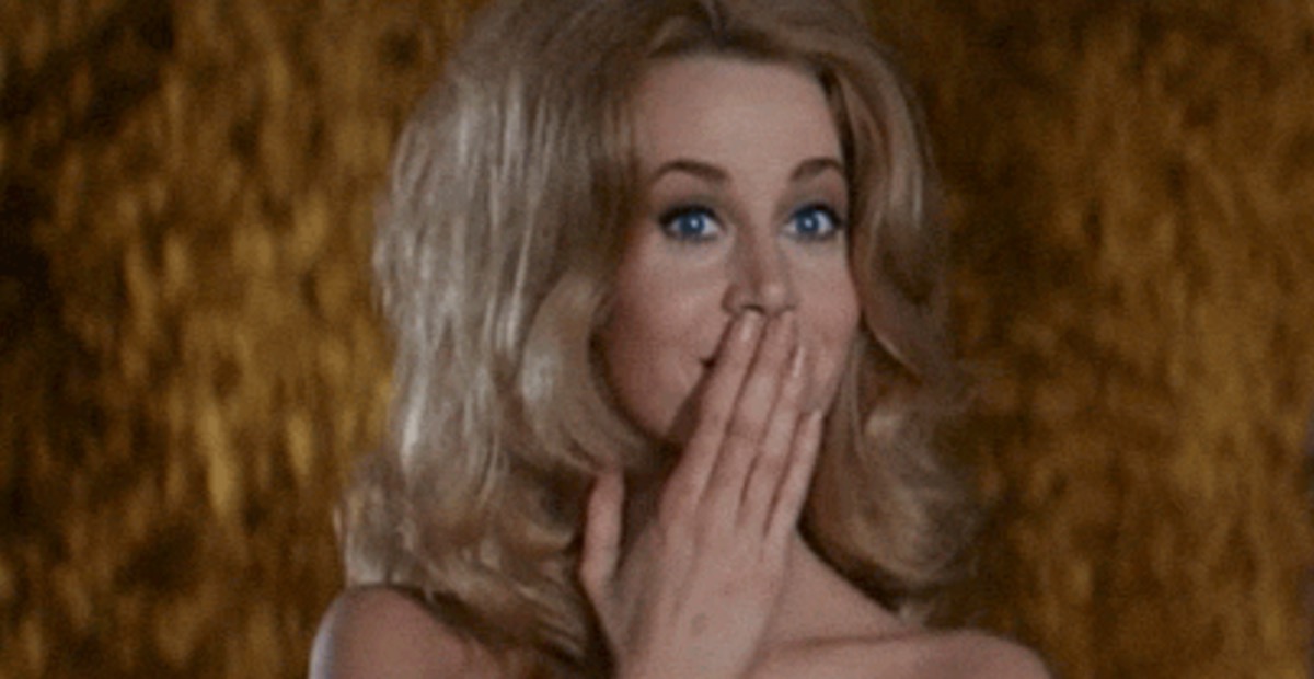 Jane Fonda covers her mouth in Barbarella.