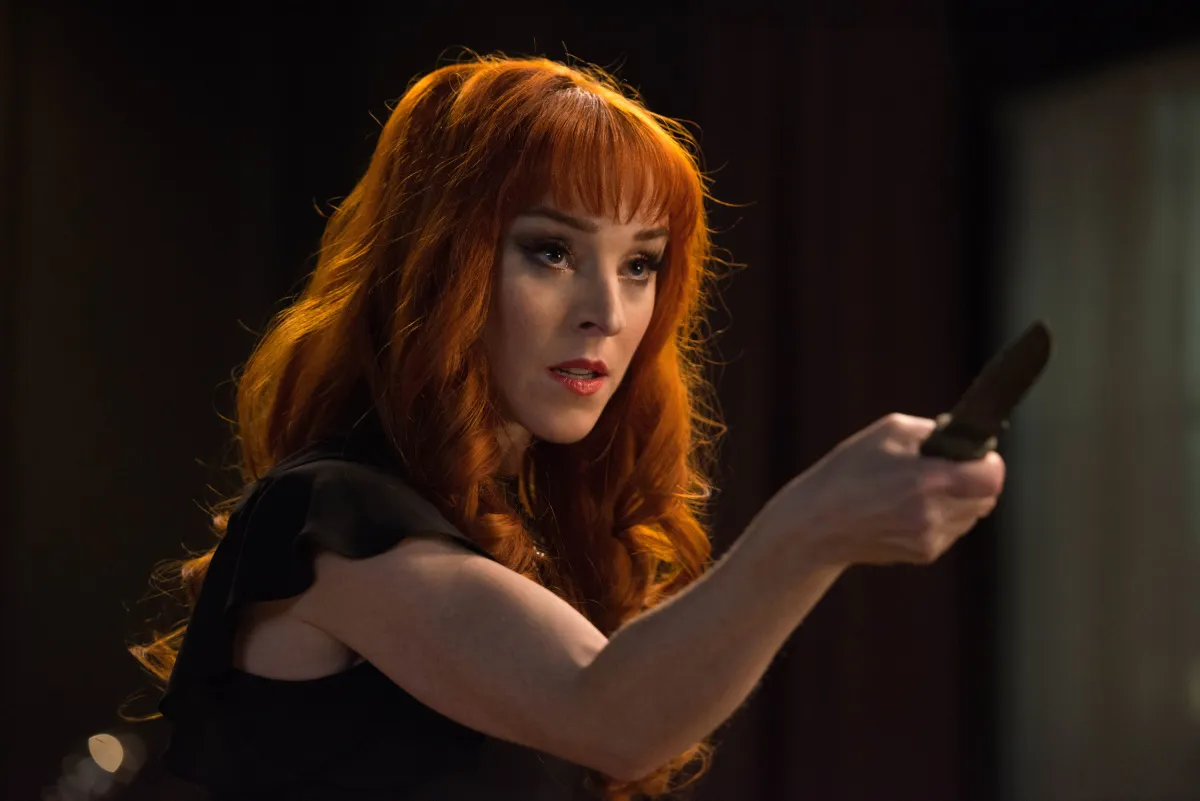 Actress Ruth Connell as Rowena brandishing a knife on Supernatural.