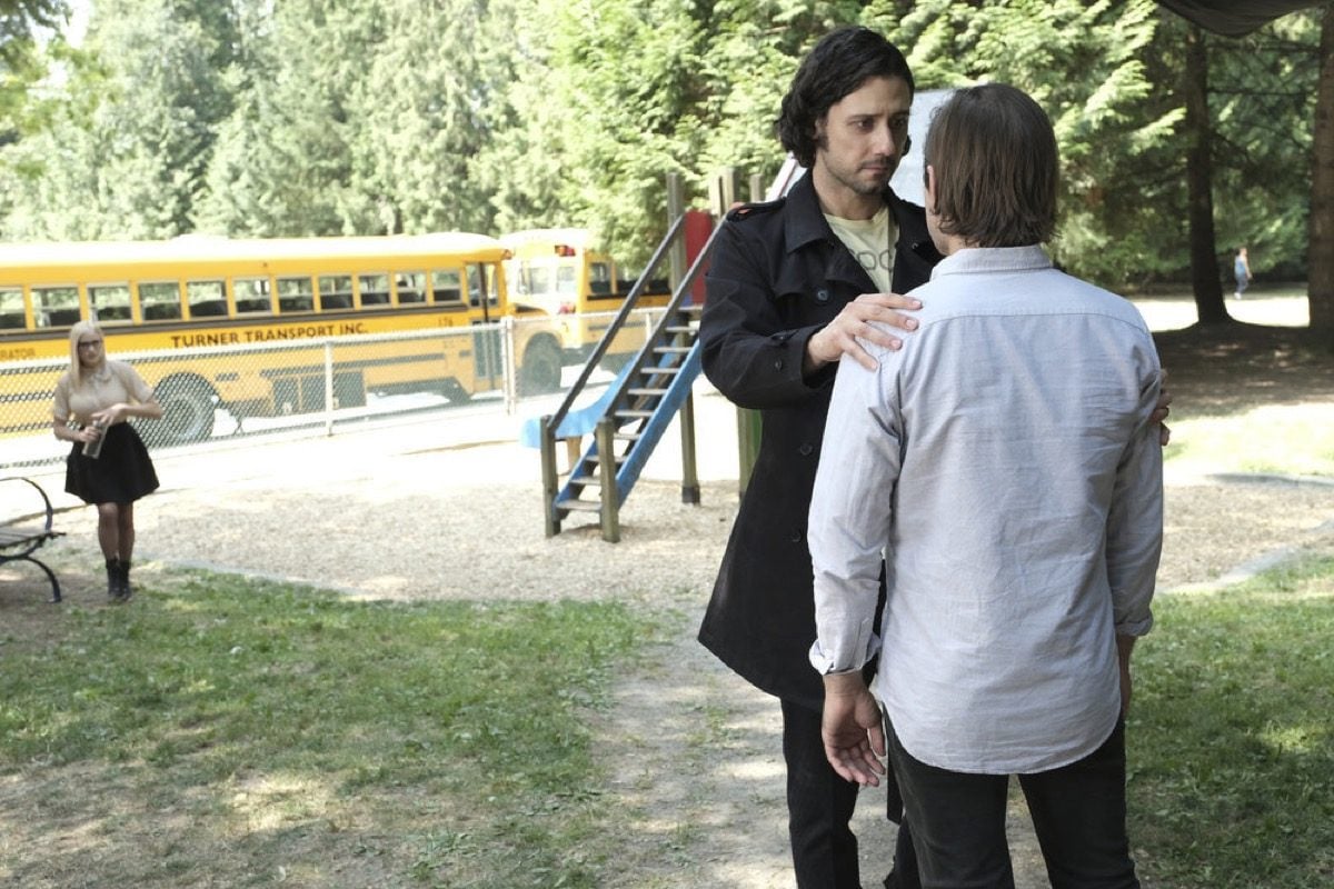 Eliot holds Quentin by the shoulders in The Magicians.