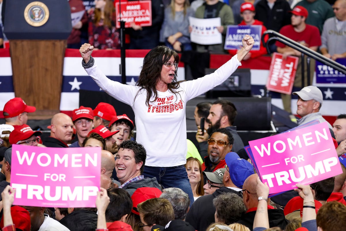 Women for Trump signs at a Republican rally.