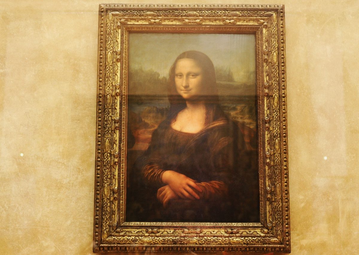 The famous Leonardo Da Vinci painting ' The Mona Lisa' is seen on display in the Grande Galerie of the Louvre museum on August 24, 2005 in Paris, France. Dan Brown is the author of numerous bestsellers, including Digital Fortress, Angels and Demons, and Deception Point. His acclaimed novel 'The Da Vinci Code'has become one of the most widely read books of all time. (Photo by Pascal Le Segretain/Getty Images)