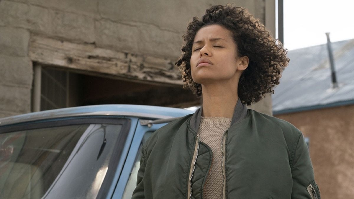 Fast color movie still. Ruth standing with her eyes closed.