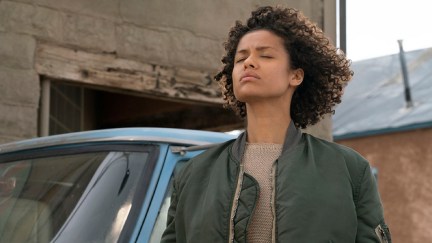 Fast color movie still. Ruth standing with her eyes closed.