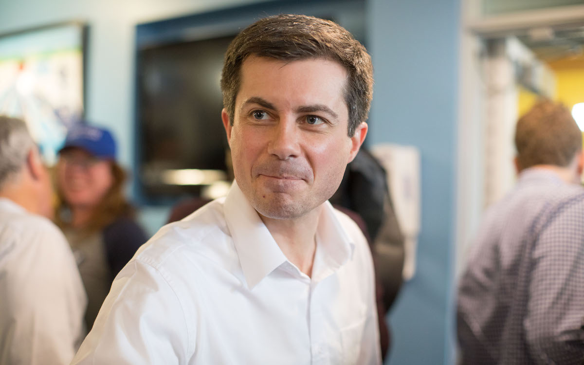 Pete Buttigieg bites his lips, presumably to keep from laughing at how bad Jacob Wohl is at crime.