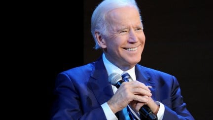 Joe Biden smiles as he talks.