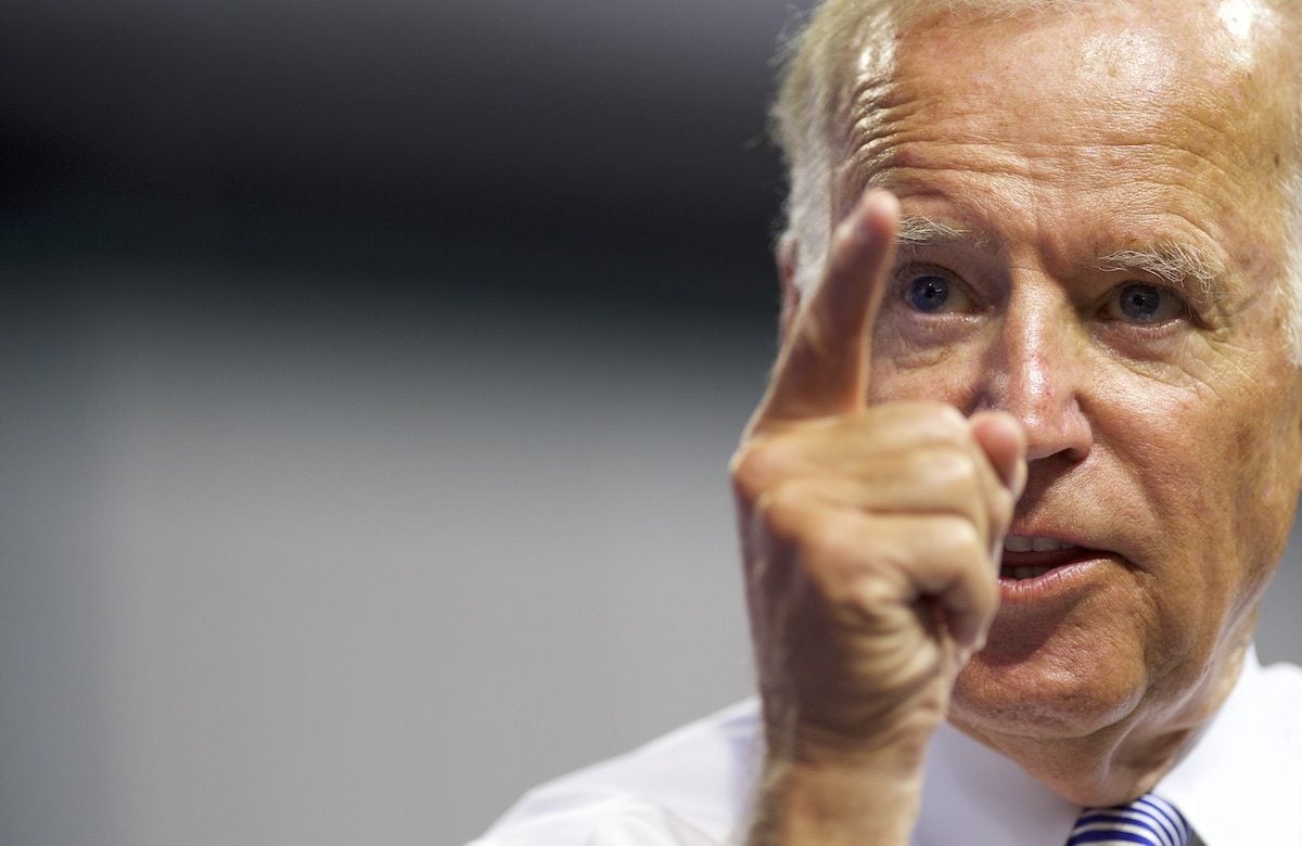 Joe Biden points his finger and looks angry.