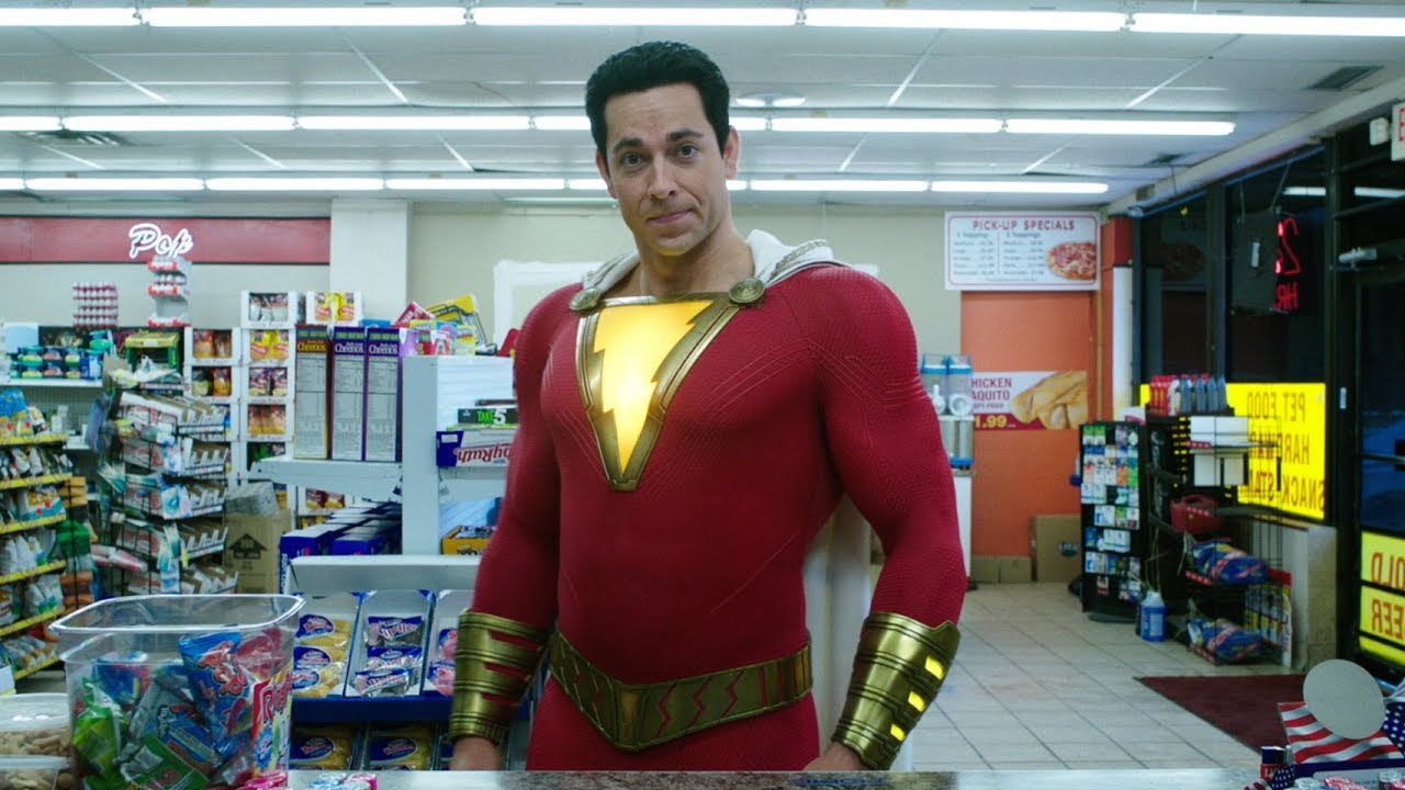 Shazam standing in front of the counter at a convenience store.