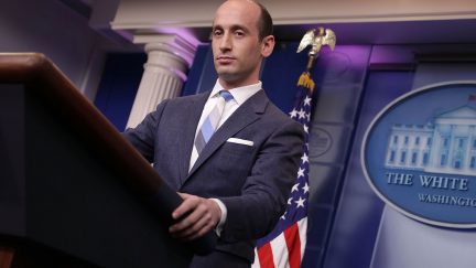 White Nationalist Steven Miller stands at the White House press briefing podium.