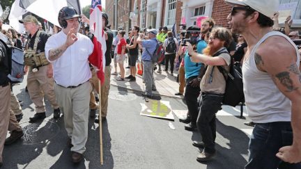 CHARLOTTESVILLE, VA - AUGUST 12: Hundreds of white nationalists, neo-Nazis and members of the 'alt-right' are confronted by protesters as they march down East Market Street toward Emancipation Park during the 'Unite the Right' rally August 12, 2017 in Charlottesville, Virginia. After clashes with anti-fascist protesters and police the rally was declared an unlawful gathering and people were forced out of Emancipation Park, where a statue of Confederate General Robert E. Lee is slated to be removed.