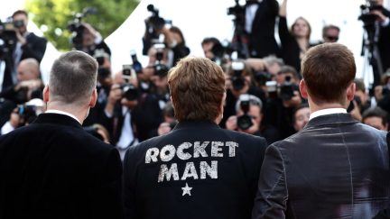 Elton John wearing Rocket Man jacket at Cannes Rocketman movie premiere.