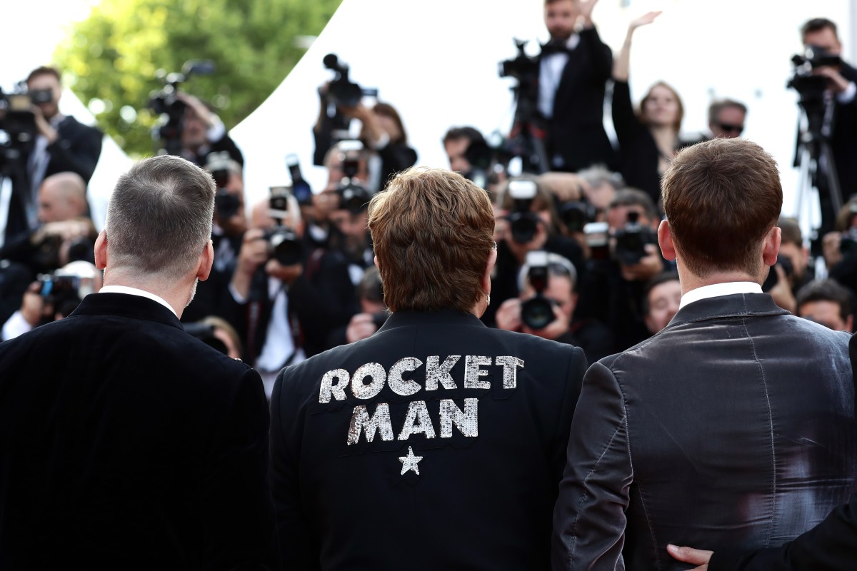 Elton John wearing Rocket Man jacket at Cannes Rocketman movie premiere.
