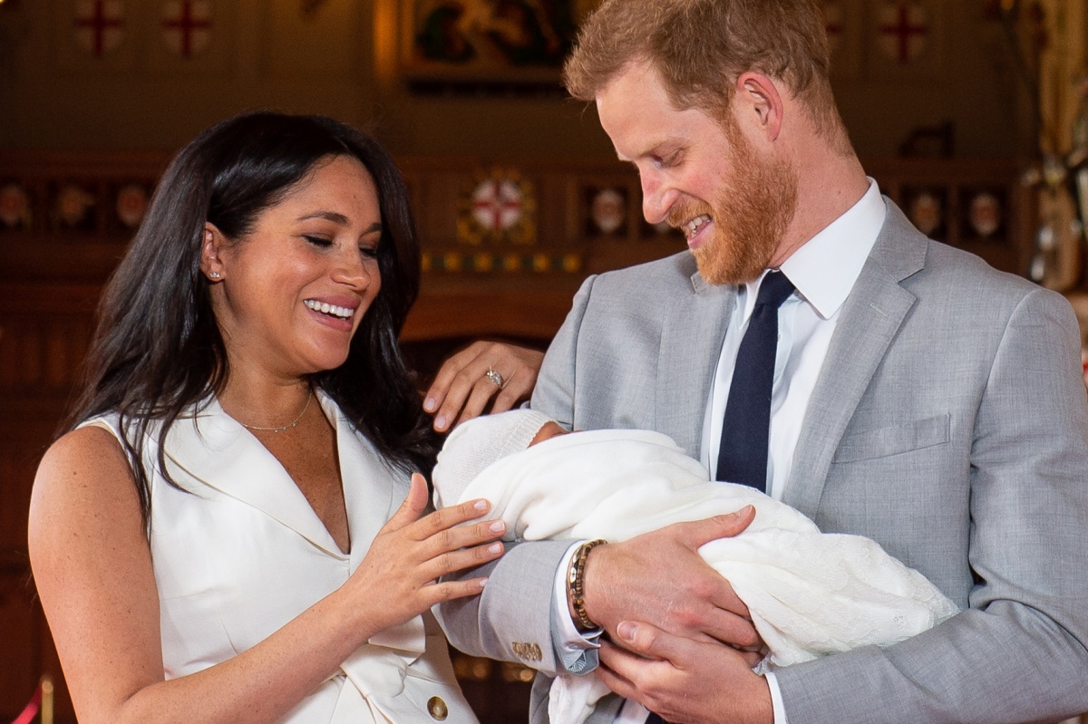 Britain's Prince Harry, Duke of Sussex (R), and his wife Meghan, Duchess of Sussex, pose for a photo with their newborn baby son, Archie Harrison Mountbatten-Windsor, in St George's Hall at Windsor Castle in Windsor, west of London on May 8, 2019. (Photo by Dominic Lipinski / POOL / AFP) (Photo credit should read DOMINIC LIPINSKI/AFP/Getty Images)