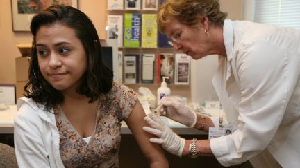 University of Iowa junior Erica Zamudil, 22, (L) receives a mumps, measles and rubella vaccination shot from nurse Jan Bush at the school's Student Health Service April 27, 2006 in Iowa City, Iowa. Mass vaccination clinics were set up in college towns across Iowa as public health officials try to contain a mumps epidemic. The University of Iowa has had 62 confirmed cases of mumps. (Photo by Mark Kegans/Getty Images)