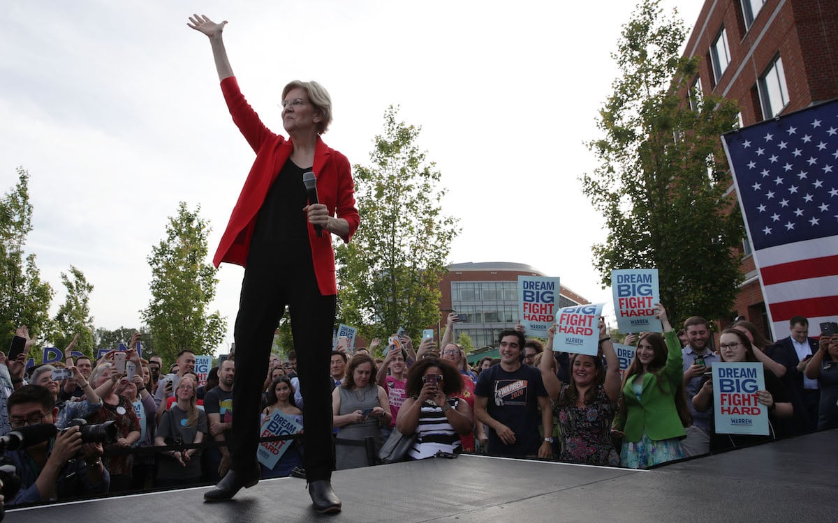 Sen. Elizabeth Warren (D-MA) waves during a campaign town hall