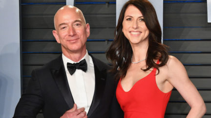 MacKenzie and Jeff Bezos pose on the Vanity Fair Oscar Party red carpet.
