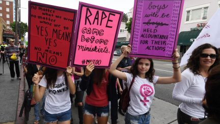 Victims of sexual harassment, sexual assault, sexual abuse and their supporters protest during a #MeToo march in Hollywood, California on November 12, 2017. Several hundred women gathered in front of the Dolby Theatre in Hollywood before marching to the CNN building to hold a rally. / AFP PHOTO / Mark RALSTON (Photo credit should read MARK RALSTON/AFP/Getty Images)