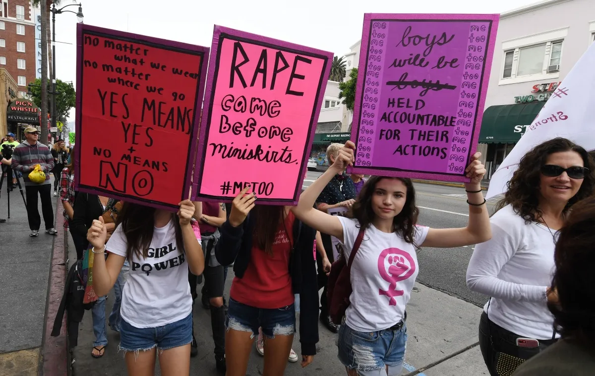 Victims of sexual harassment, sexual assault, sexual abuse and their supporters protest during a #MeToo march in Hollywood, California on November 12, 2017. Several hundred women gathered in front of the Dolby Theatre in Hollywood before marching to the CNN building to hold a rally. / AFP PHOTO / Mark RALSTON (Photo credit should read MARK RALSTON/AFP/Getty Images)